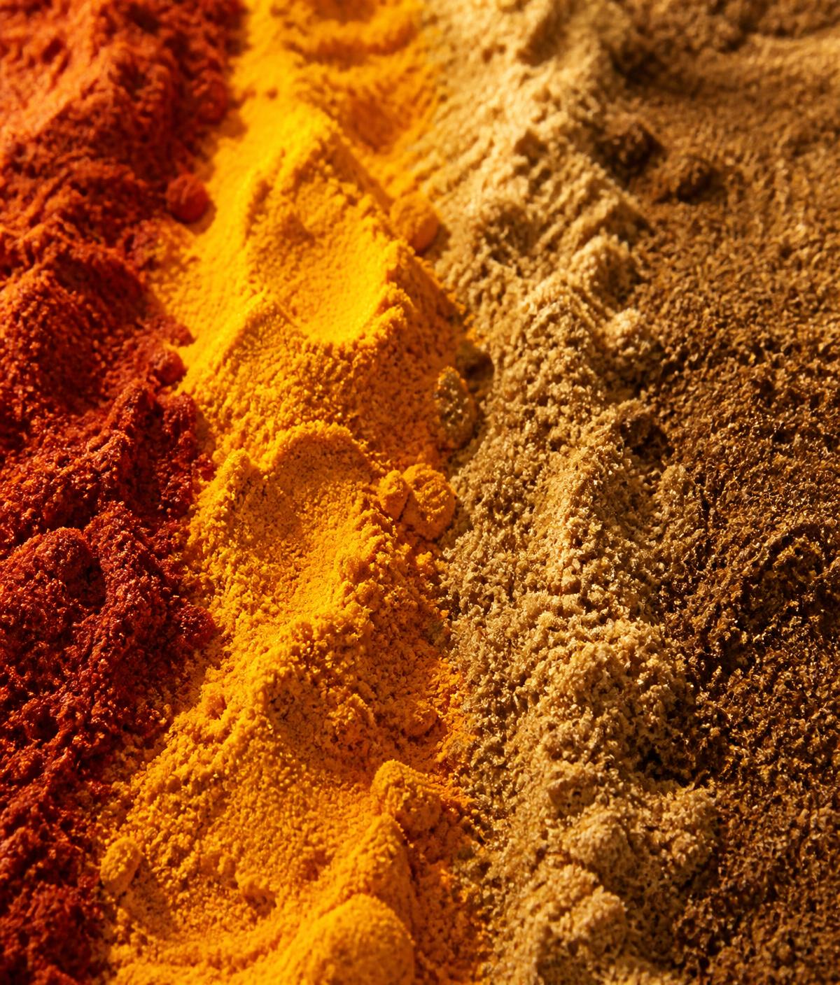 Macro photograph of freshly ground chilli, turmeric and coriander